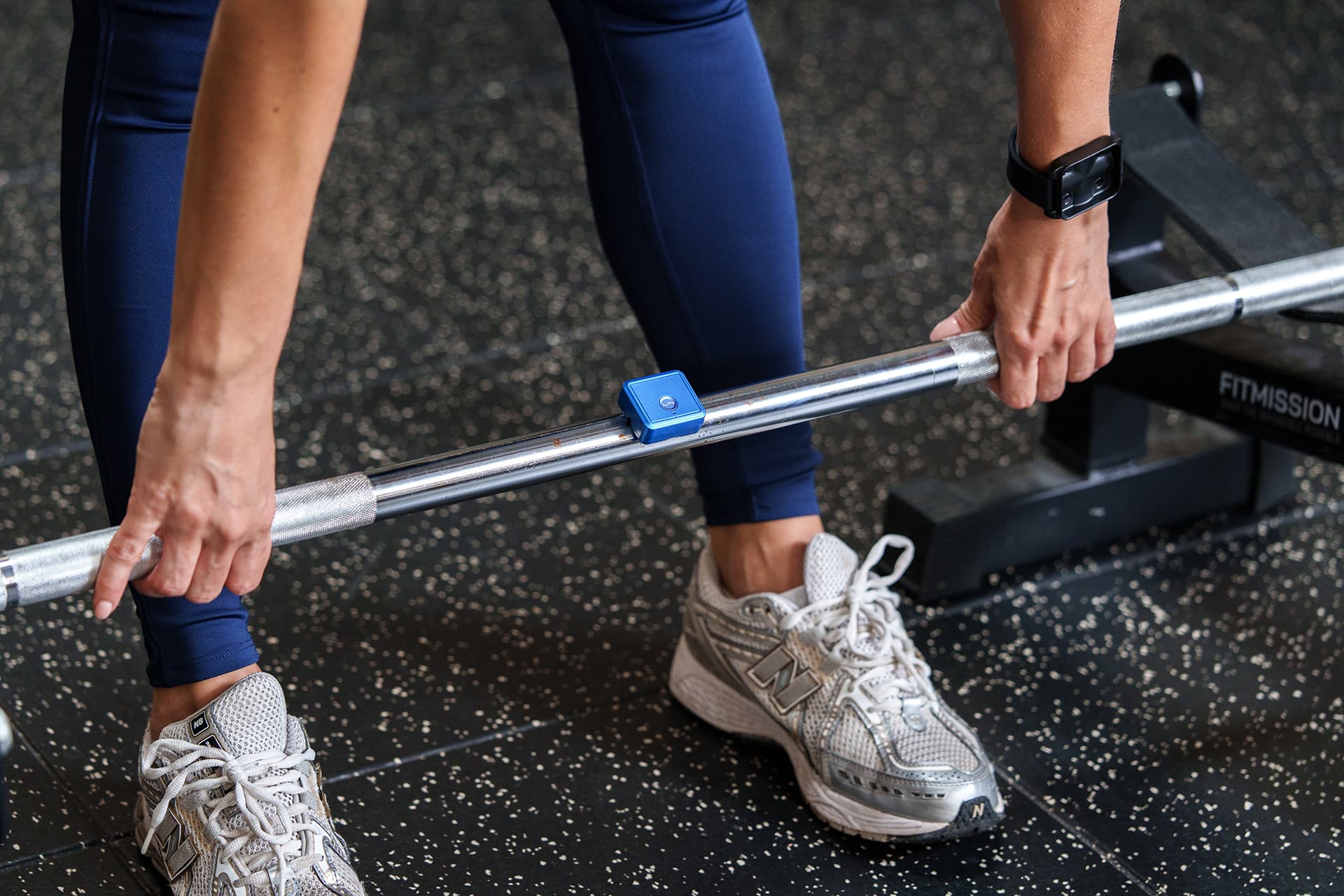 Athlete performing deadlift with PoinT GO sensor attached